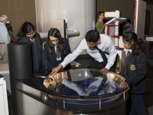 Students and their teacher interact with an exhibit at a Science Museum Group gallery.