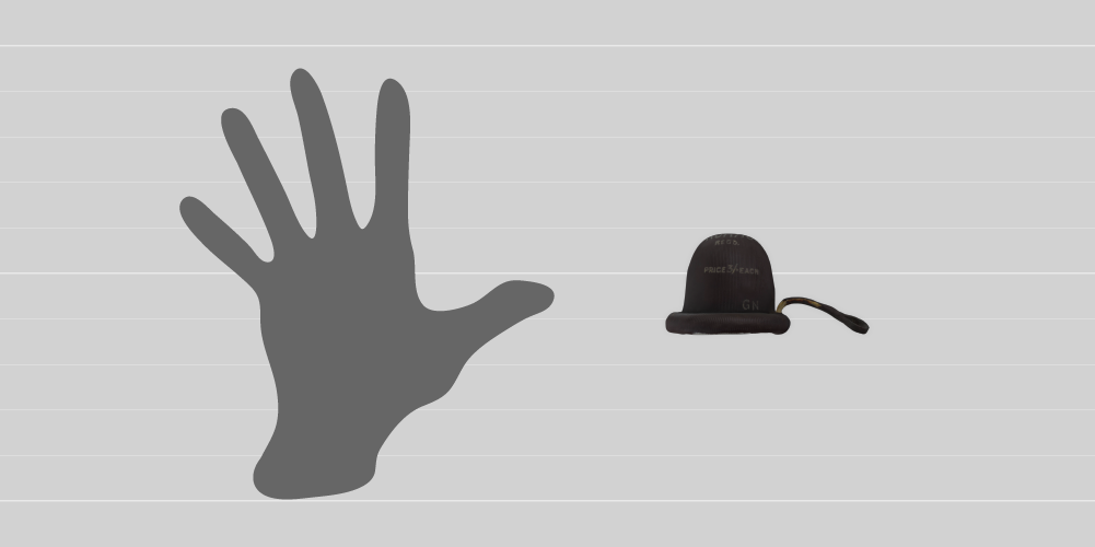 A comparison in size between a 19cm human hand and the 4cm contraceptive cap. 