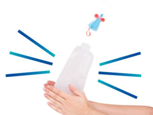 Hands squeezing the bottom of a plastic bottle making a small blue mouse with red ears to fly off the top