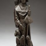 Statuette of St. Roch, wood, northern Germany, 15th century. Full view, graduated grey background.